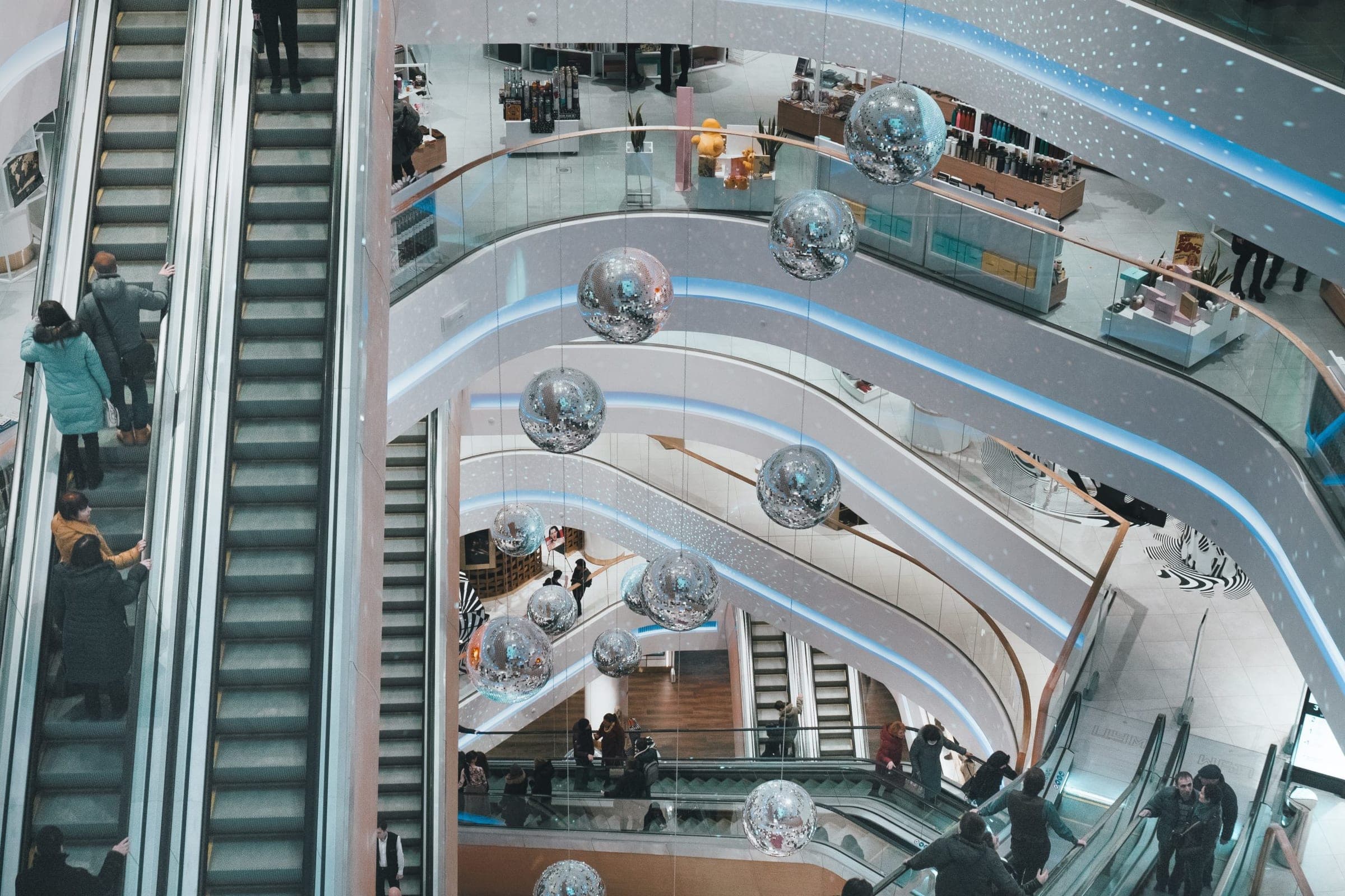 aerial view of escalators in a mall atrium