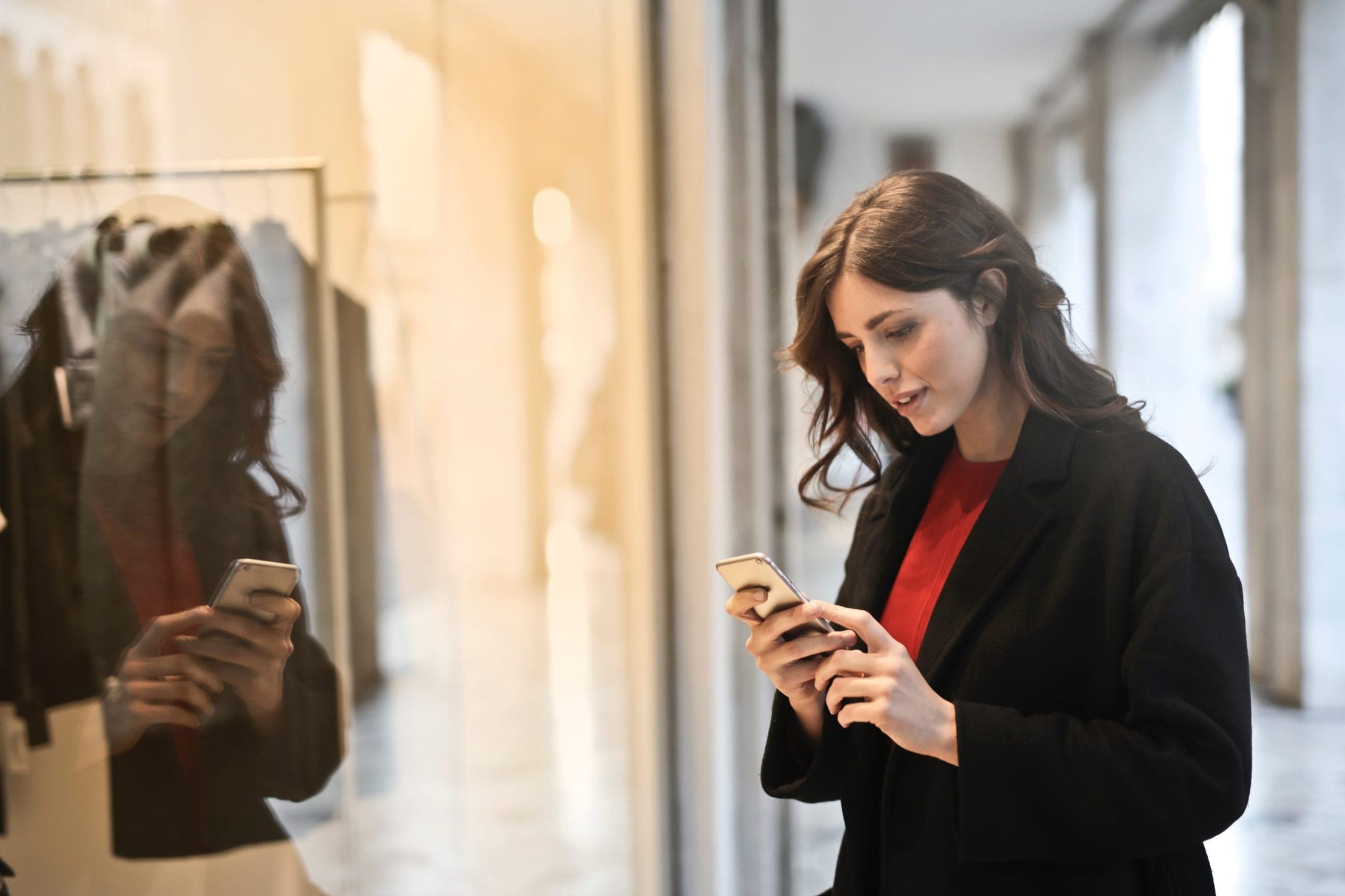 woman using mobile phone in a store