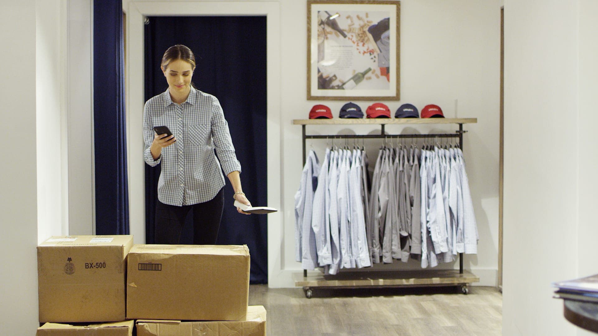 Store associate using an RFID wand in a retail setting